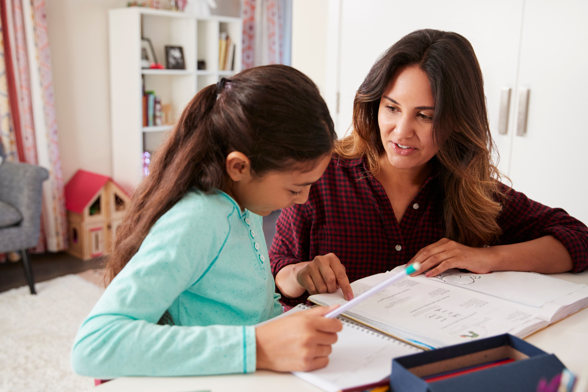 Mother helping child with their homework