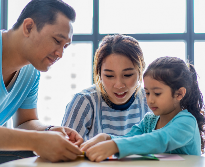 Bilingual parents talking to young child