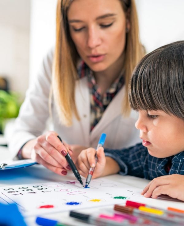 Child having psychology assessment with psychologist