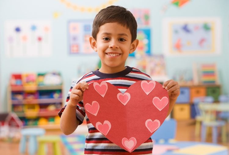 Boy in Preschool holding picture of heart