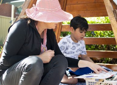 Learning Links Preschool teacher reading with child