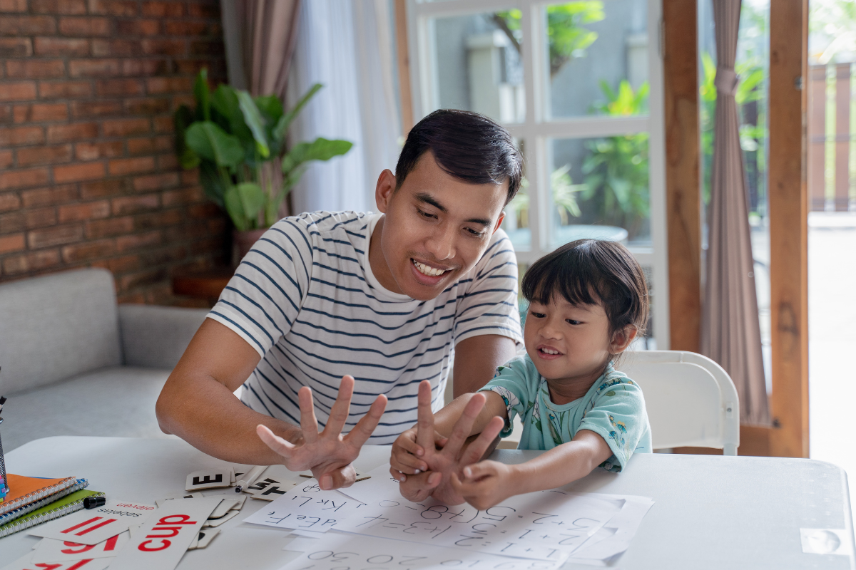 Father and child practicing counting together