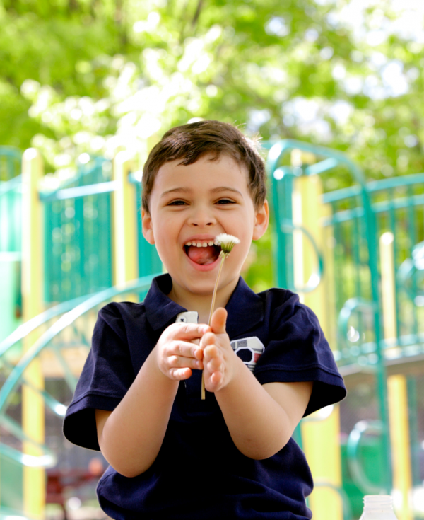 Young child with disability in playground