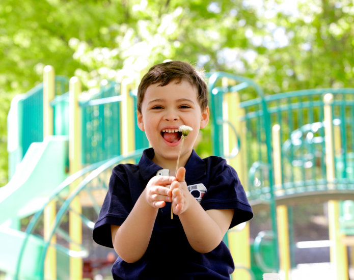 Young child with disability in playground