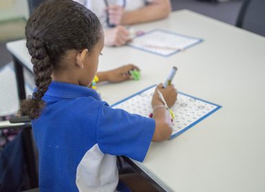 Girl in school working on numeracy resources in Learning Links program