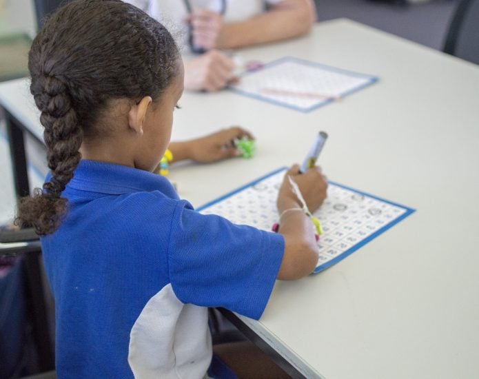 Girl in school working on numeracy resources in Learning Links program