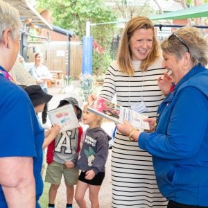 Learning Links staff member presenting certificate to Officeworks staff member